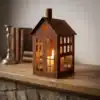 Rustic House Candle Holder Lantern Rustic house candle holder lantern glowing on a tabletop