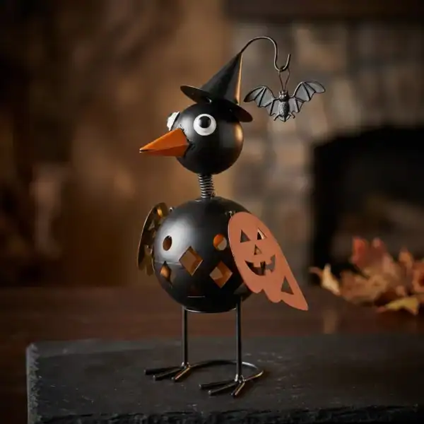 Witchy crow Halloween tabletop decor with pumpkin and bat detail