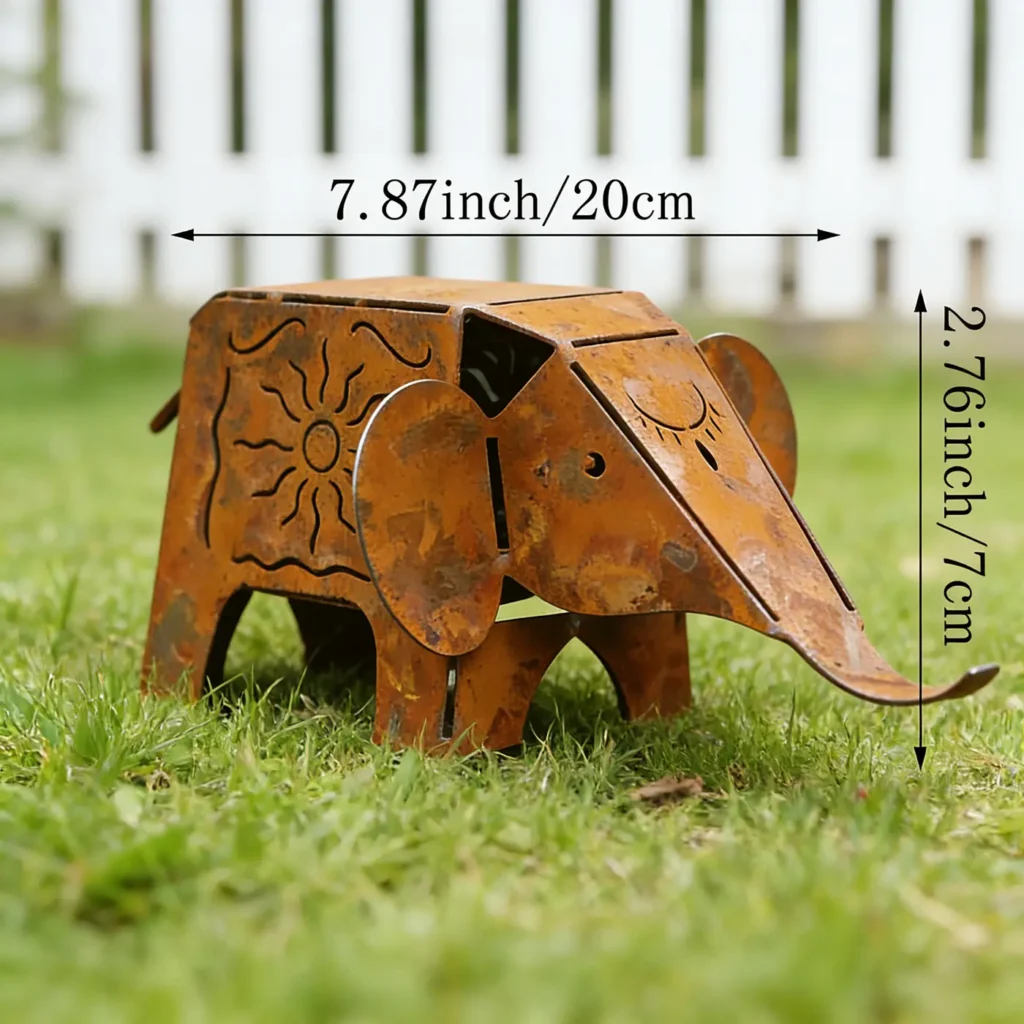 Rustic elephant garden statue with aged finish in a garden