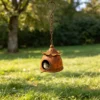 Rustic hanging birdhouse with round entry and decorative chain