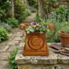 rustic-telephone-planter-01 Rustic vintage telephone planter filled with flowers in a garden