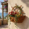 Rustic ship wheel wall planter with flowers for a nautical garden display
