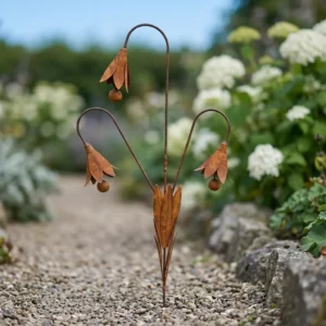 Rustic bluebell flower garden stake in an outdoor garden