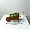 Rustic wheelbarrow planter for garden and patio decor