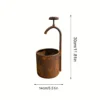 Rustic faucet shaped planter for garden flowers