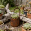 Rustic faucet shaped planter for garden flowers
