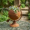 Rustic globe planter with flowers for garden decor