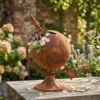 Rustic globe planter with flowers for garden decor