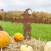Rustic iron scarecrow garden stake with bird accent for fall decor